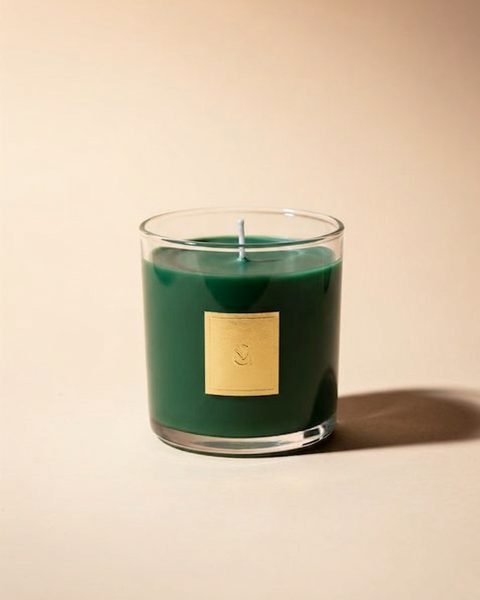 One real edit shown as a split: the left half is the picture before, the right half after "make @candle deep forest green with a small gold label". Only the marked place changed; everything else is the same picture.